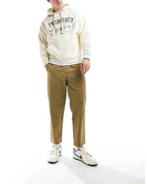 Farah Hawtin tekniska avslappnade tapered byxor i beige