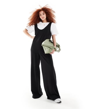 ASOS DESIGN 2 i 1 snickarbyxor med vida ben i svart