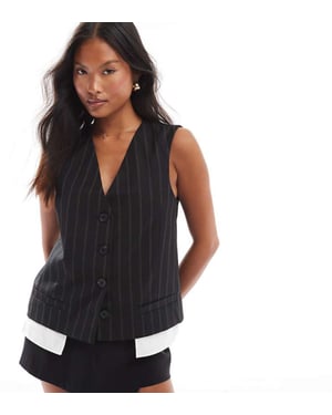 ASOS DESIGN Petite exponerad fickväst i svart rand
