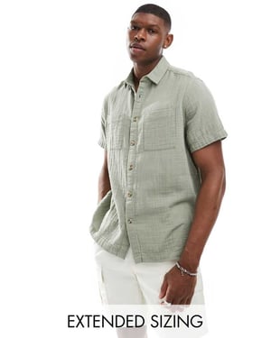 ASOS DESIGN kortärmad avslappnad skjorta med omvänd krage i ljus khaki av cheese cloth