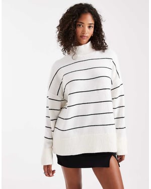 ASOS DESIGN stickad höghalshals tröja med vändbara muddar i monostrip.