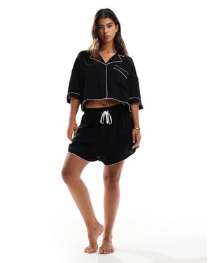 ASOS DESIGN supermjuka slinky mini pyjamasshorts i svart med kontrastkant