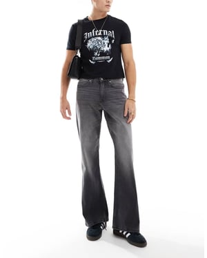 ASOS DESIGN vida utsvängda jeans i tvättad svart