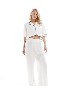 ASOS DESIGN Hög supermjuk slinky vida pyjamasbyxor i vitt med kontrasterande detaljer