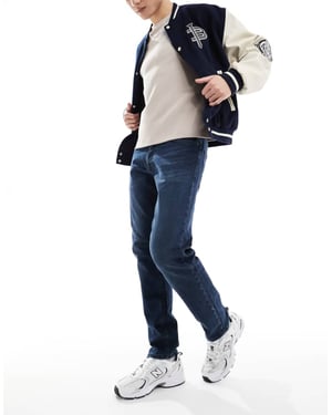 Jack & Jones Mike tapered jeans i mörkblå tvätt