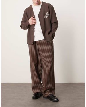 ASOS DESIGN wide leg smart trousers with turn up hem in brown stripe