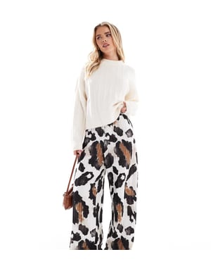 Vero Moda Petite plisse wide leg trousers in abstract cow print
