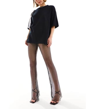 ASOS DESIGN fishnet hotfix flare trousers in black