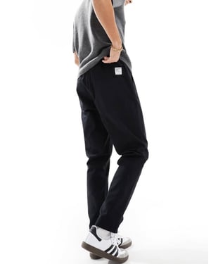 ASOS DESIGN tapered pull on trousers in black with patch