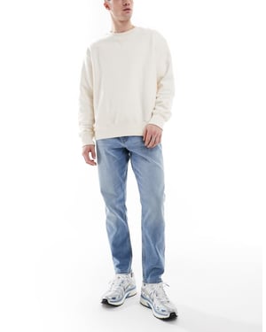 ASOS DESIGN stretch tapered jeans in light wash
