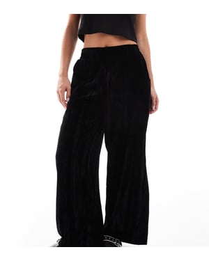 ASOS DESIGN Petite crinkle velvet pull on trouser in black
