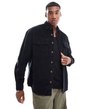 ASOS DESIGN 90s cord oversized shirt with patch pocket in black