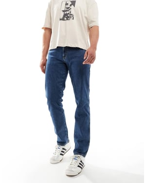 Wrangler Texas slim fit jeans in mid wash