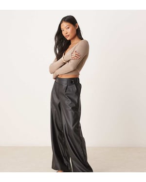 JDY Petite high waisted wide leg faux leather trousers in black