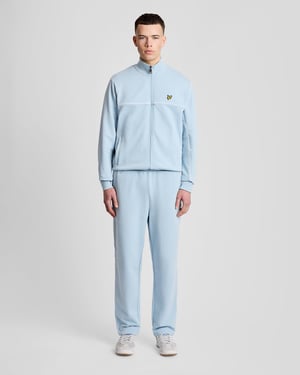 Raka ben med kantad track pants