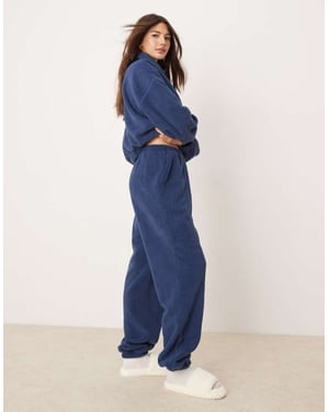 ASOS DESIGN lounge microfleece joggers i mörkblå