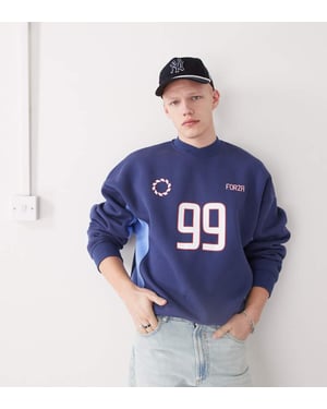 COLLUSION fotbolls sweatshirts i blått