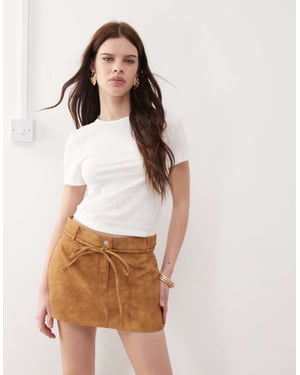Monk västerländsk imitat läder låg midja mini kjol med knytning i beige