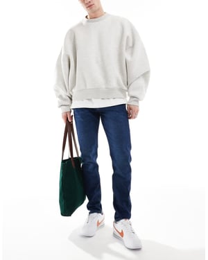 Calvin Klein Jeans slim tapered jeans in dark wash