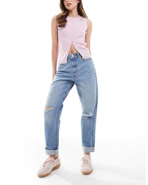 ASOS DESIGN högmidjade avslappnade momjeans i mellanwash med knärevor