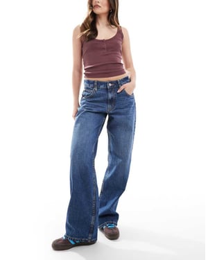 ASOS DESIGN lågt skurna baggy jeans i mörkblå