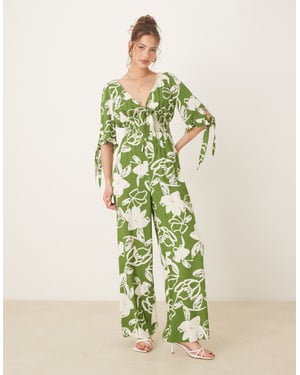 ASOS DESIGN shirred waist jumpsuit action in green floral