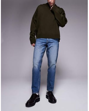 ASOS DESIGN stretch tapered jeans med ton i mörk tvättblå