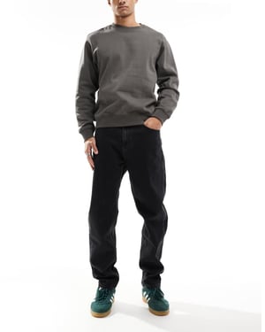 Tommy Jeans Isaac relaxed tapered jeans in black