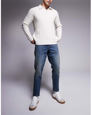 ASOS DESIGN stretch tapered jeans i medtvätt med toning