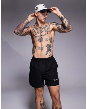 ASOS DESIGN swim shorts in mid length with embroidery placement in black