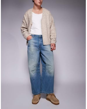 ASOS DESIGN hästskojeans i ljus tvättad blå