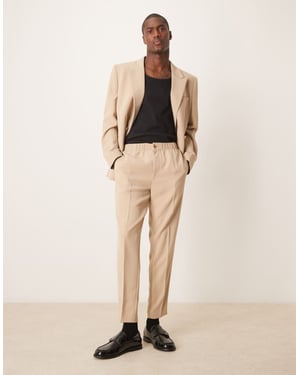 ASOS DESIGN tapered suit trousers in stone texture