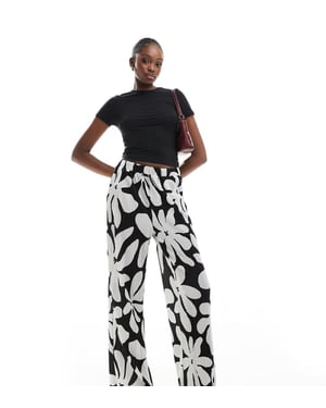 Vero Moda Tall high waist wide leg plisse trouser in monochrome floral print
