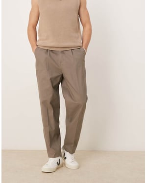 ASOS DESIGN smart oversized tapered cotton chino trousers with side adjusters in khaki