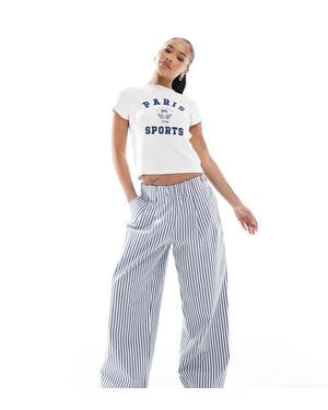 ASOS DESIGN Petite överdrivna dragkedjevid byxor med vida ben i blå rand