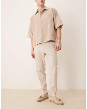 ASOS DESIGN smart tapered fit linen blend trousers in stone with turnups
