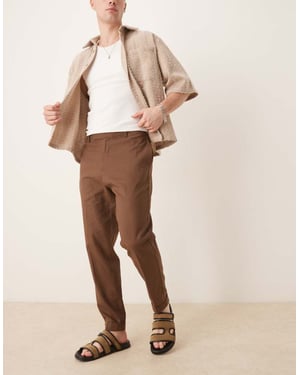 ASOS DESIGN smart tapered fit linen blend trousers in brown with turnups