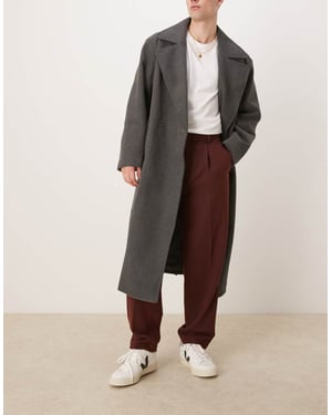 ASOS DESIGN smart oversized tapered pleated trousers in burgundy with wool twill