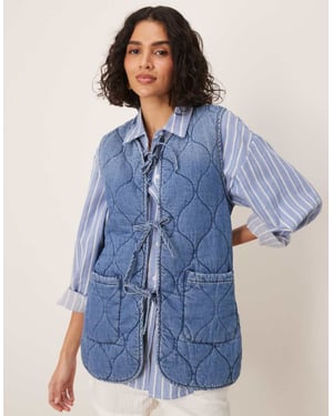 ASOS DESIGN denim quilted vest in midwash blue