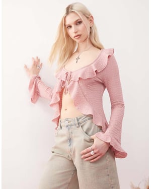 Reclaimed Vintage långärmad volangknut framtill texturerad topp i rosa