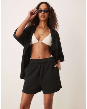 ASOS DESIGN cheesecloth pull on shorts with raw edge detail co-ord in black