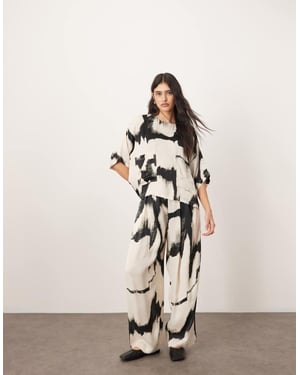 ARRANGE satin straight leg trouser co-ord in mono abstract print