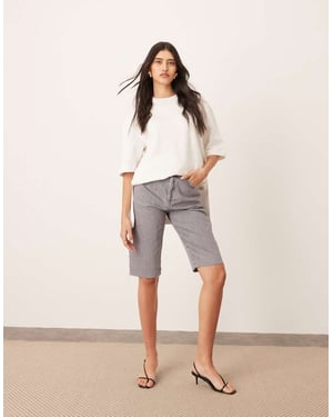 ARRANGE Cleo denim longline short with raw hem in slate grey