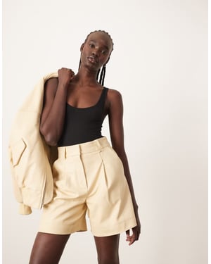 ARRANGE premium läder stadshorts set i buttermilk