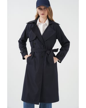 Dubbla knäppningar lång trenchcoat