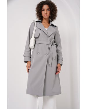 Dubbelt knäppt lång trenchcoat