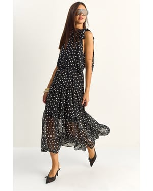 Pruik met halterkraag in polkadots midi jurk