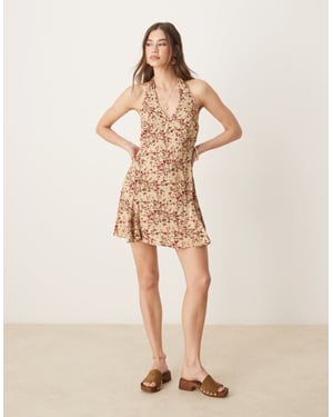 ASOS DESIGN halter neck mini dress in ditsy floral print