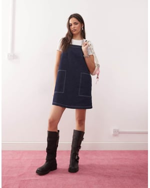 Reclaimed Vintage mini denim pinafore dress in indigo wash