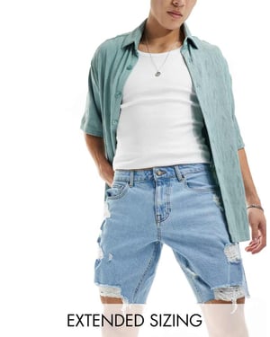 ASOS DESIGN lång denimshorts med slitage i ljus tvättad blå